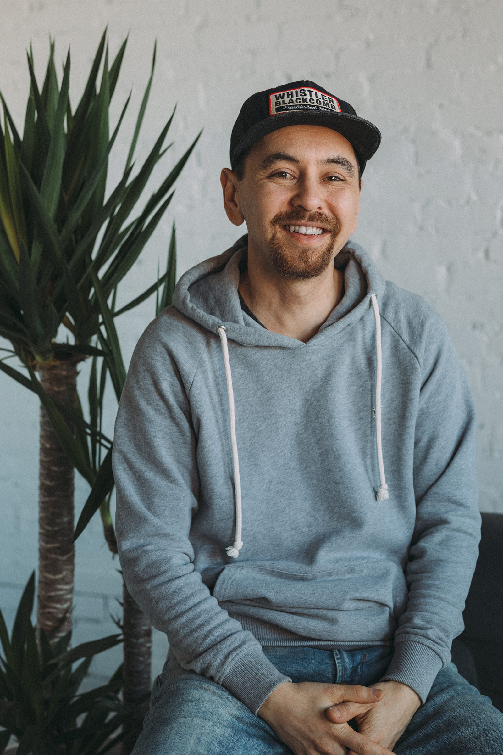 A casual portrait of photographer Sam Wong shot in his Downtown Whitby studio.